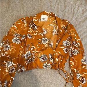 Burnt orange floral blouse